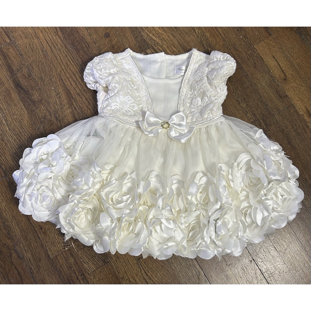 Nanette Baby With ornate array of satin roses On Hem White So Soft 3/6 Months
